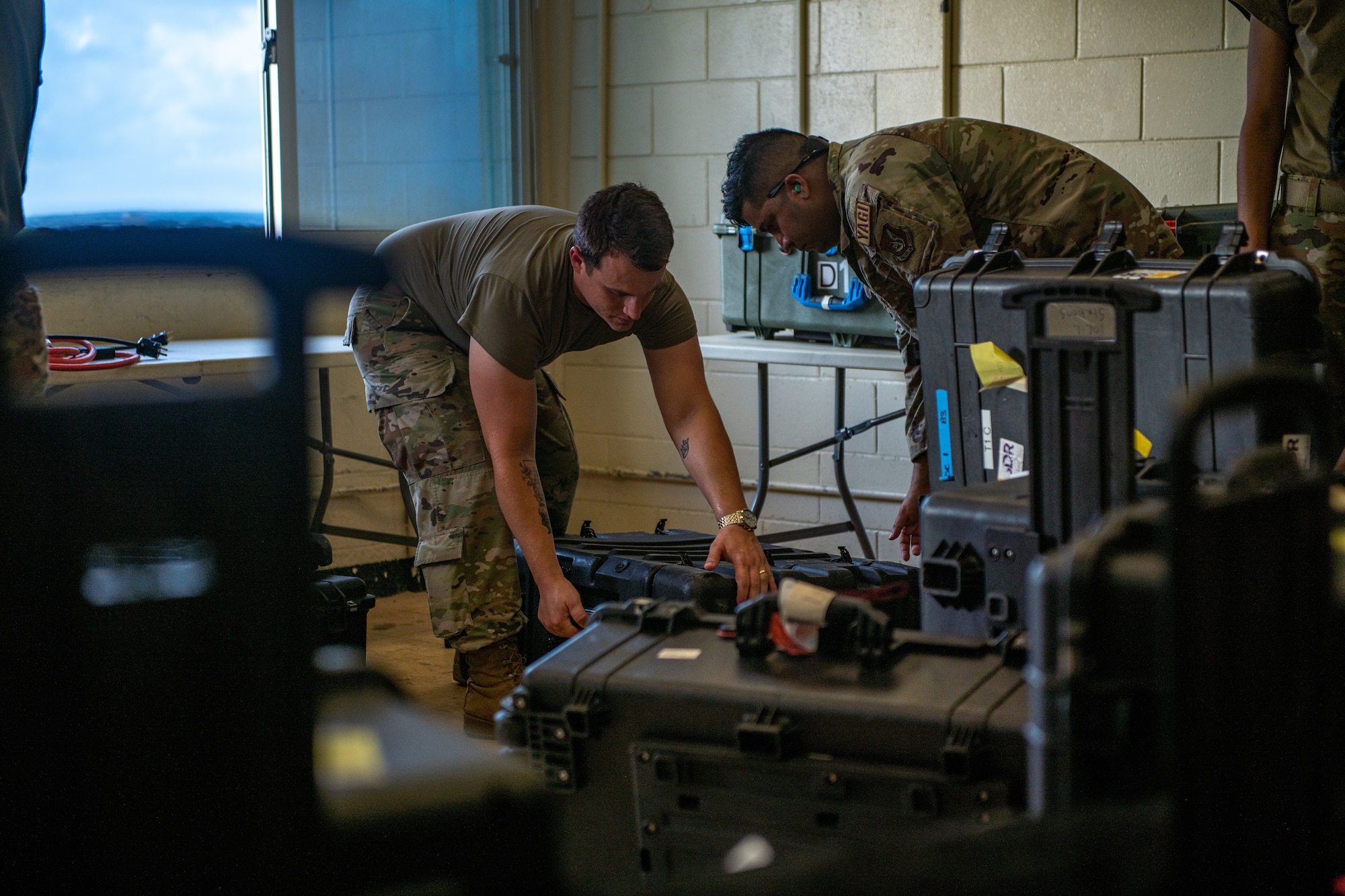 Airmen set up computer stations.