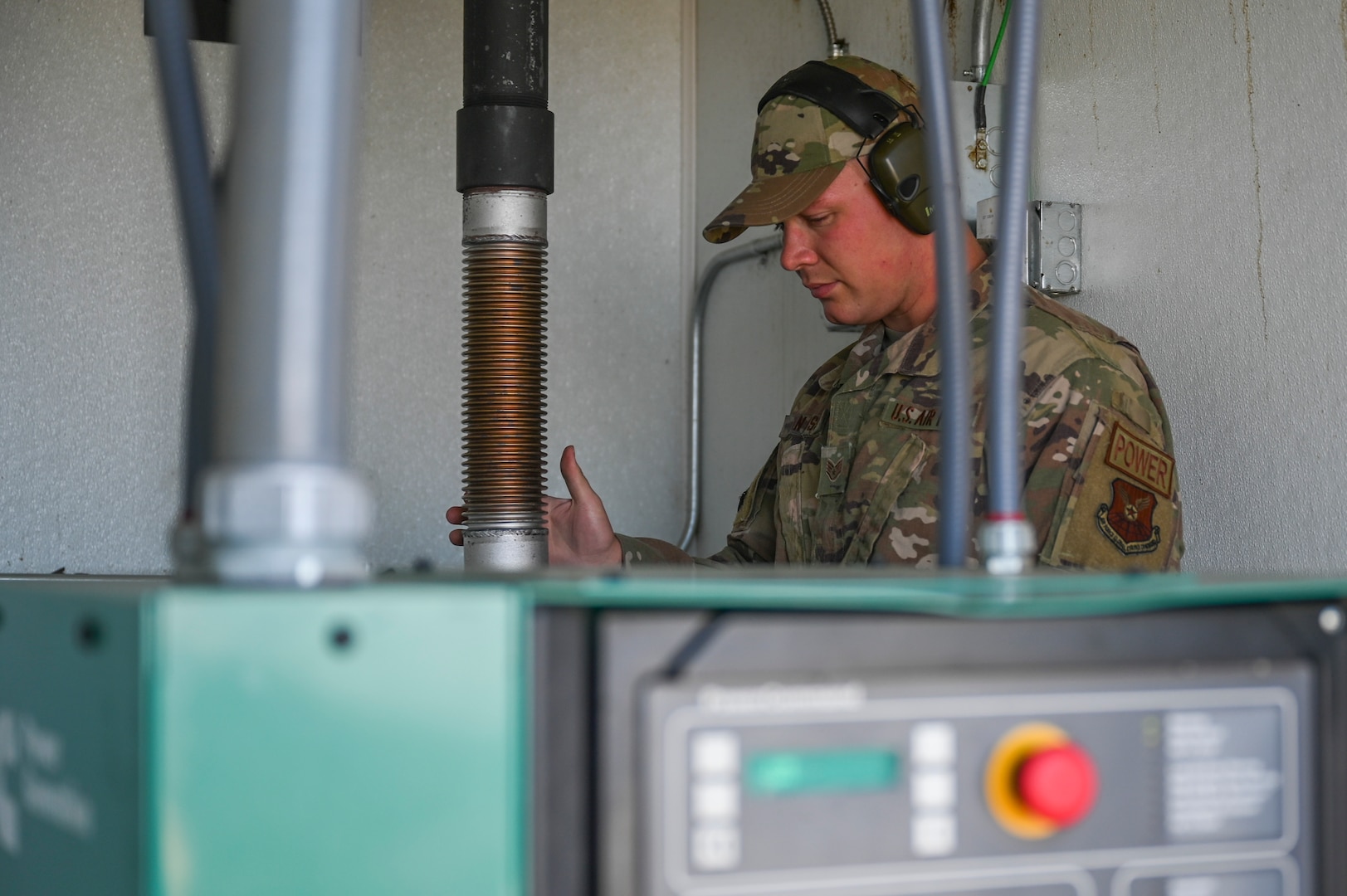 An Airman maintains a generator