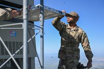 An Airman pulls out an old air filter.