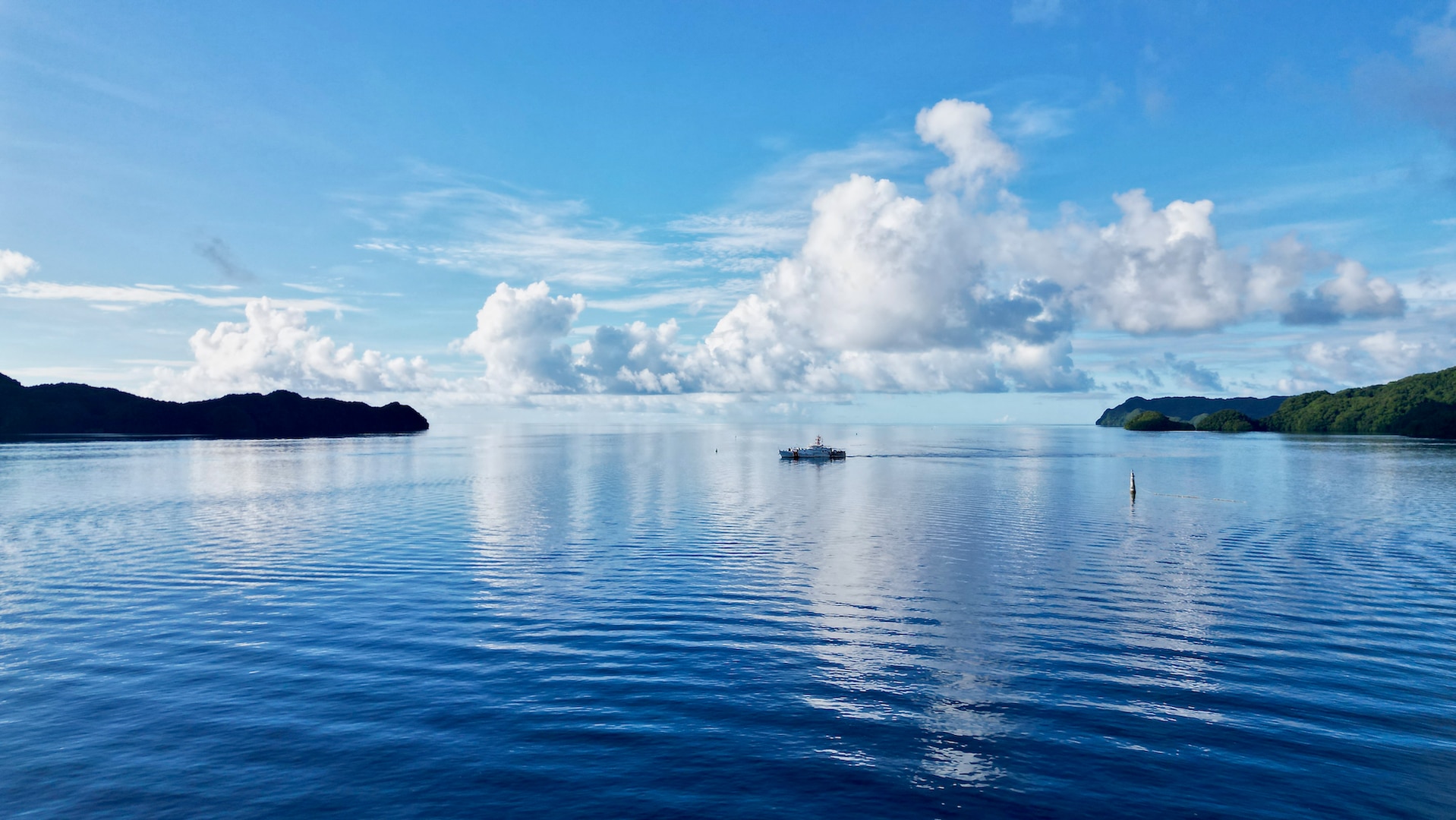 The crew of USCGC Oliver Henry (WPC 1140) arrives in Palau on April 1, 2023, to continue their second expeditionary patrol in nine months. The team returned to Guam on April 9, 2023, following the 30-day patrol supporting the Pacific Islands Forum Fisheries Agency's Operation 365 and Operation Rematau to stop illegal, unreported, and unregulated fishing in the Pacific. (U.S. Coast Guard photo by Chief Warrant Officer Sara Muir)