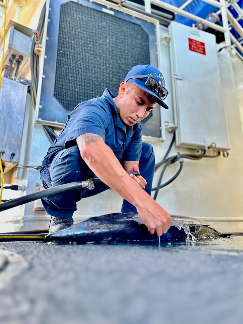 Petty Officer 1st Class Ikaika Ruiz cleans a Wahoo for a Gyotaku print while aboard the USCGC Oliver Henry (WPC 1140) while underway off the Republic of Palau on April 1, 2023. Originally from Hawaii, Ruiz is an engineer aboard the ship specializing as an electrician. (U.S. Coast Guard photo by Chief Warrant Officer Sara Muir)