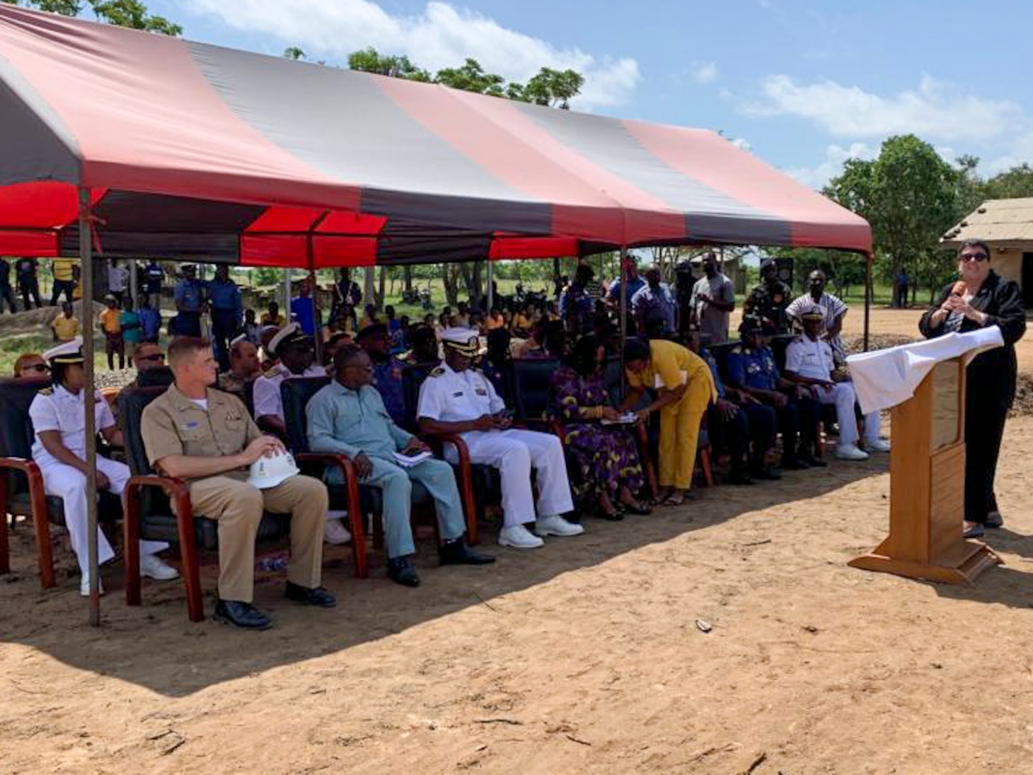 NUTEKPOR, Ghana (July 14, 2023) Village residents and Seabees assigned to Naval Mobile Construction Battalion (NMCB) 1 pose for a group photo during the commissioning of the Nutekpor District Assembly Basic School Nutekpor, Ghana, July 14, 2023. The school was constructed in partnership by NMCB 1 and Marines from the 8th Engineer Support Battalion, 2nd Marine Logistics Group. NMCB 1 operates as a part of Navy Expeditionary Combat Command and is assigned to Commander, Task Force 68 for deployment across the U.S. Naval Forces Europe-Africa area of operations to defend U.S., allied, and partner interests. (U.S. Navy photo by Construction Mechanic 2nd Class Richard Pang)