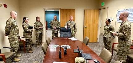 Alaska Army National Guard State Command Sergeant Major John Phlegar and Brig. Gen. James Palembas, commander, Alaska Army National Guard and assistant adjutant general, visit Soldiers of the 297th Regional Support Group participating in Pershing Strike 23 and Mobilization Exercise Level II at Fort Riley, Kansas, July 23, 2023.