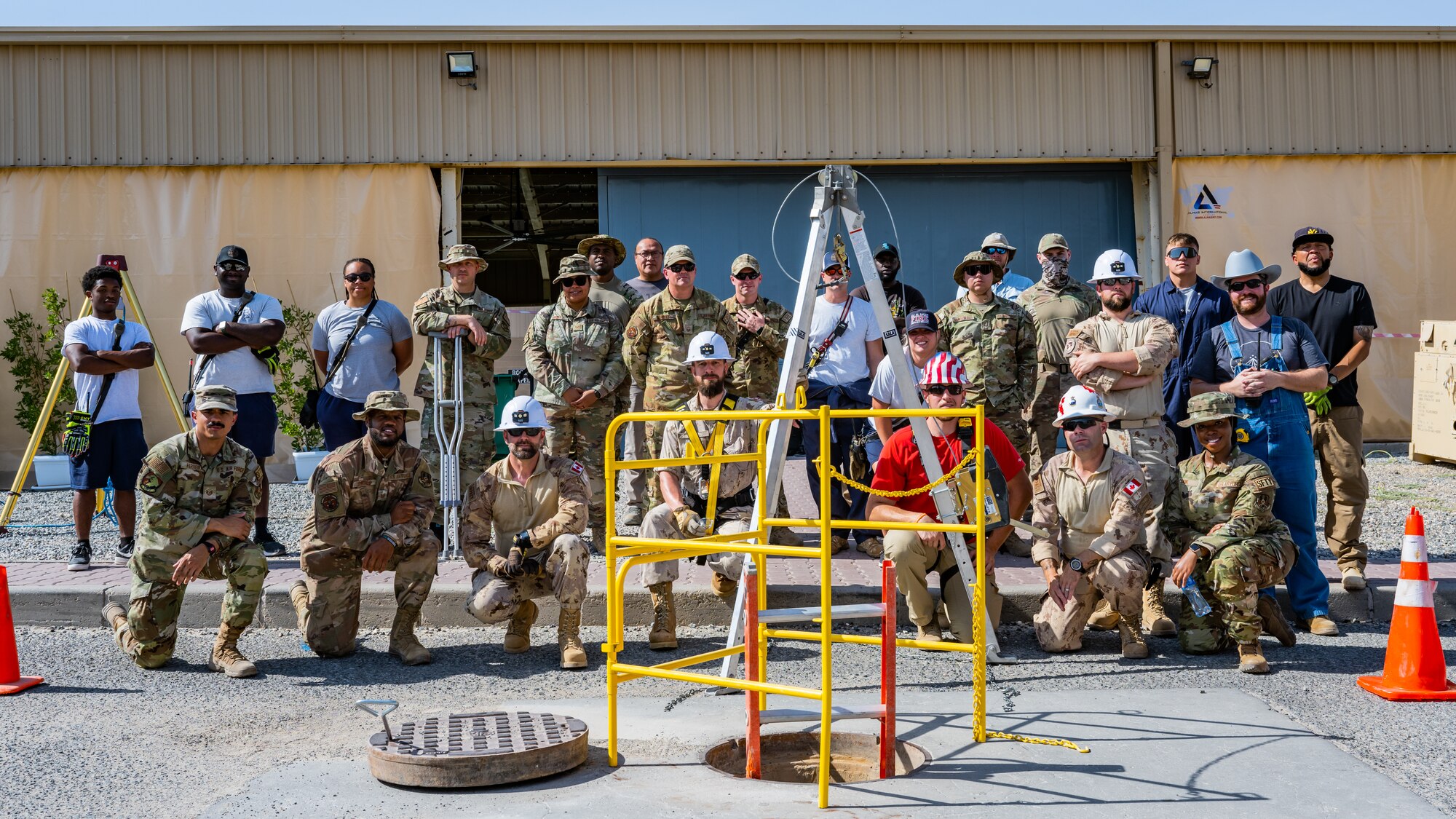 U.S. and Canadian personnel pose for a photo after completing confined-space training together at Ali Al Salem Air Base, Kuwait, July 25, 2023. This confined-space training allowed for the U.S. and our Canadian partners to share their knowledge and expertise, thus reducing the risks associated with confined-space operations for all. (U.S. Air Force photo by Staff Sgt. Kevin Long)
