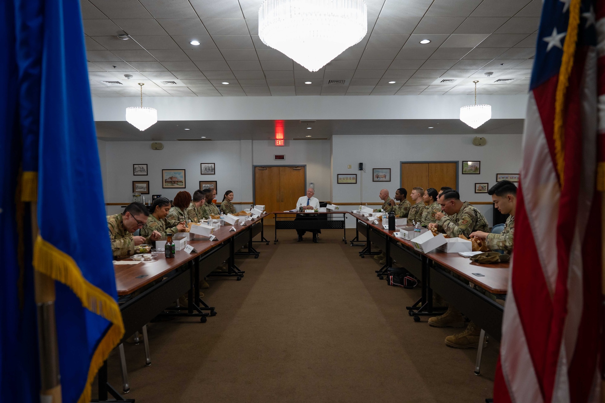 Secretary of the Air Force having a table discussion with Airmen
