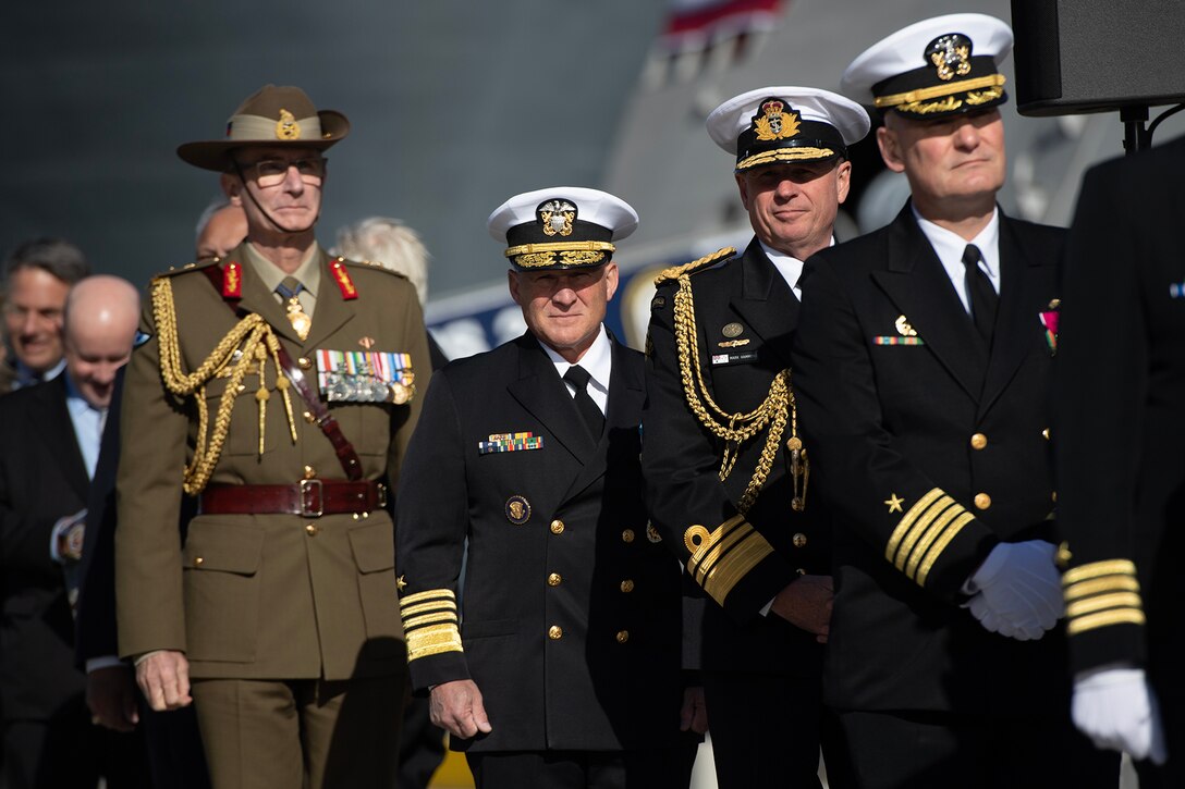U.S. and Australian military leaders arrive for a ship's commissioning.