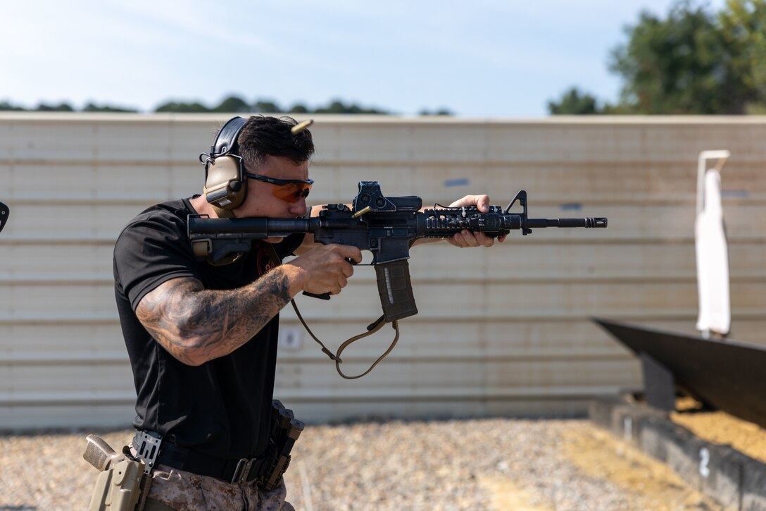 U.S. Marine Corps Toby Schindler, a close-quarters battles instructor with Marine Corps Security Forces Regiment conducts a demonstration prior to the start of a live-fire exercise at Naval Support Activity Northwest Annex, Chesapeake, Virginia, July 26, 2023. U.S. Marines and British Royal Marines train with M4 Carbine Rifles to increase proficiency. Exercise Tartan Eagle is an annual bilateral training exercise for the U.S. Marines and British Royal Marines with 43 Commando Fleet Protection Group Royal Marines to travel to each other's training facilities to exchange tactics, techniques and procedures in fixed site security. (U.S. Marine Corps photo by SSgt. Servante R. Coba)