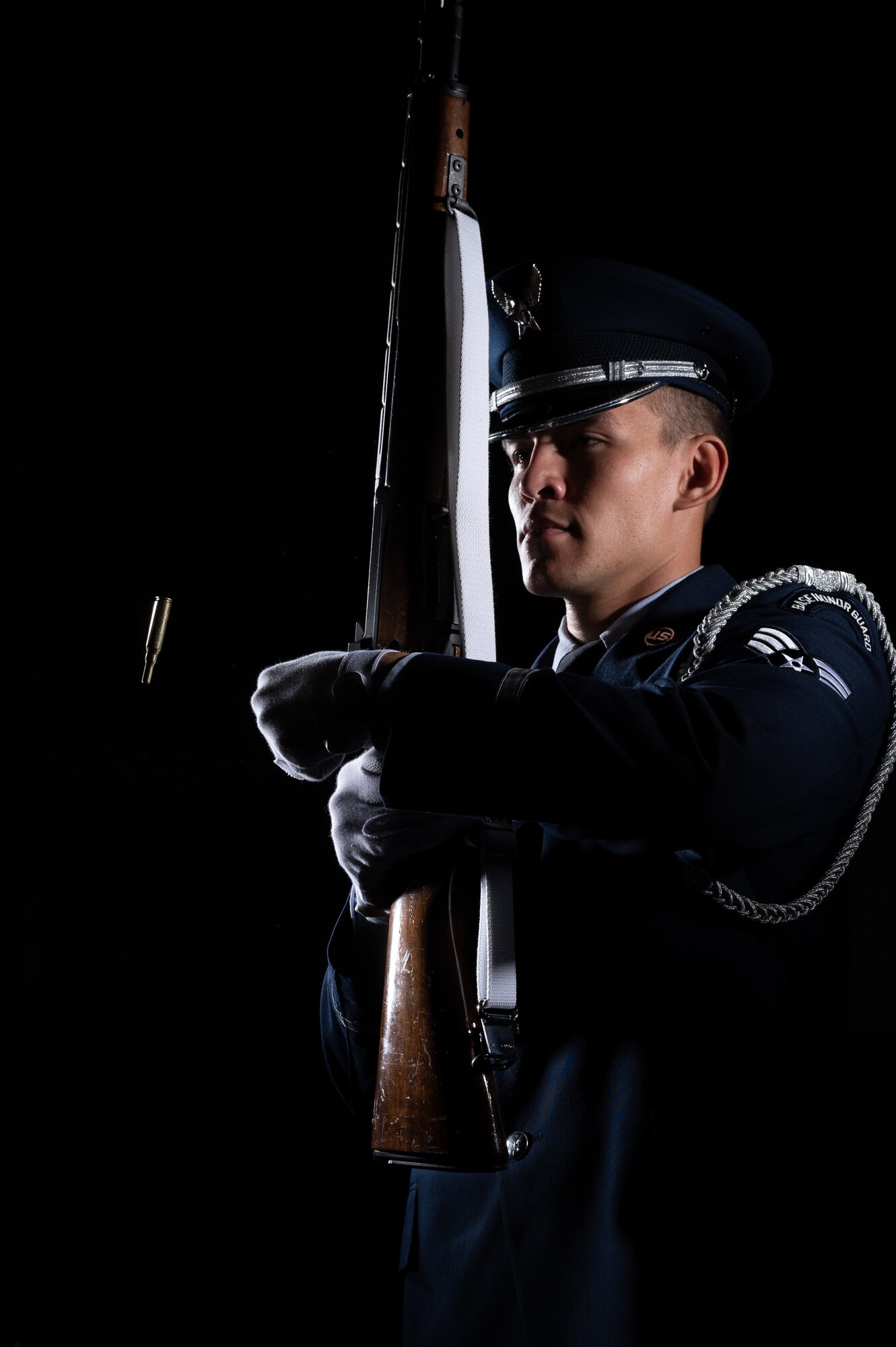 Senior Airman Wyatt Johnson, 436th Aircraft Maintenance Squadron electrical environmental specialist, ejects a casing from his rifle while practicing a 21-gun salute at the Dover Air Force Base Honor Guard facility at Dover Air Force Base, Delaware, July 25, 2023. In addition to supporting ceremonies and events at Dover AFB, the honor guard provides various military honors at funerals for veterans in Delaware, southern New Jersey, south eastern Pennsylvania, and parts of Maryland. (U.S. Air Force by Mauricio Campino)