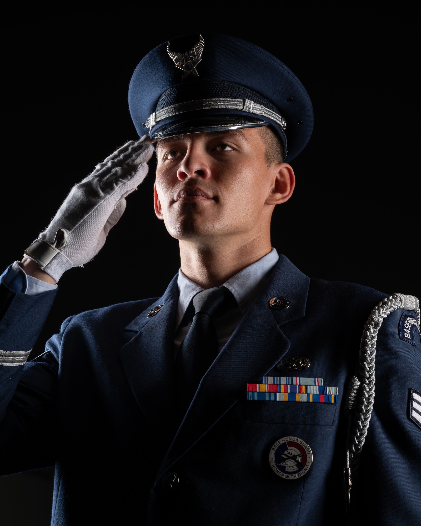 Senior Airman Wyatt Johnson, 436th Aircraft Maintenance Squadron electrical environmental specialist, salutes while practicing drill movements at the Dover Air Force Base Honor Guard facility at Dover Air Force Base, Delaware, July 25, 2023. In addition to supporting ceremonies and events at Dover AFB, the honor guard provides various military honors at funerals for veterans in Delaware, southern New Jersey, south eastern Pennsylvania, and parts of Maryland. (U.S. Air Force by Mauricio Campino)