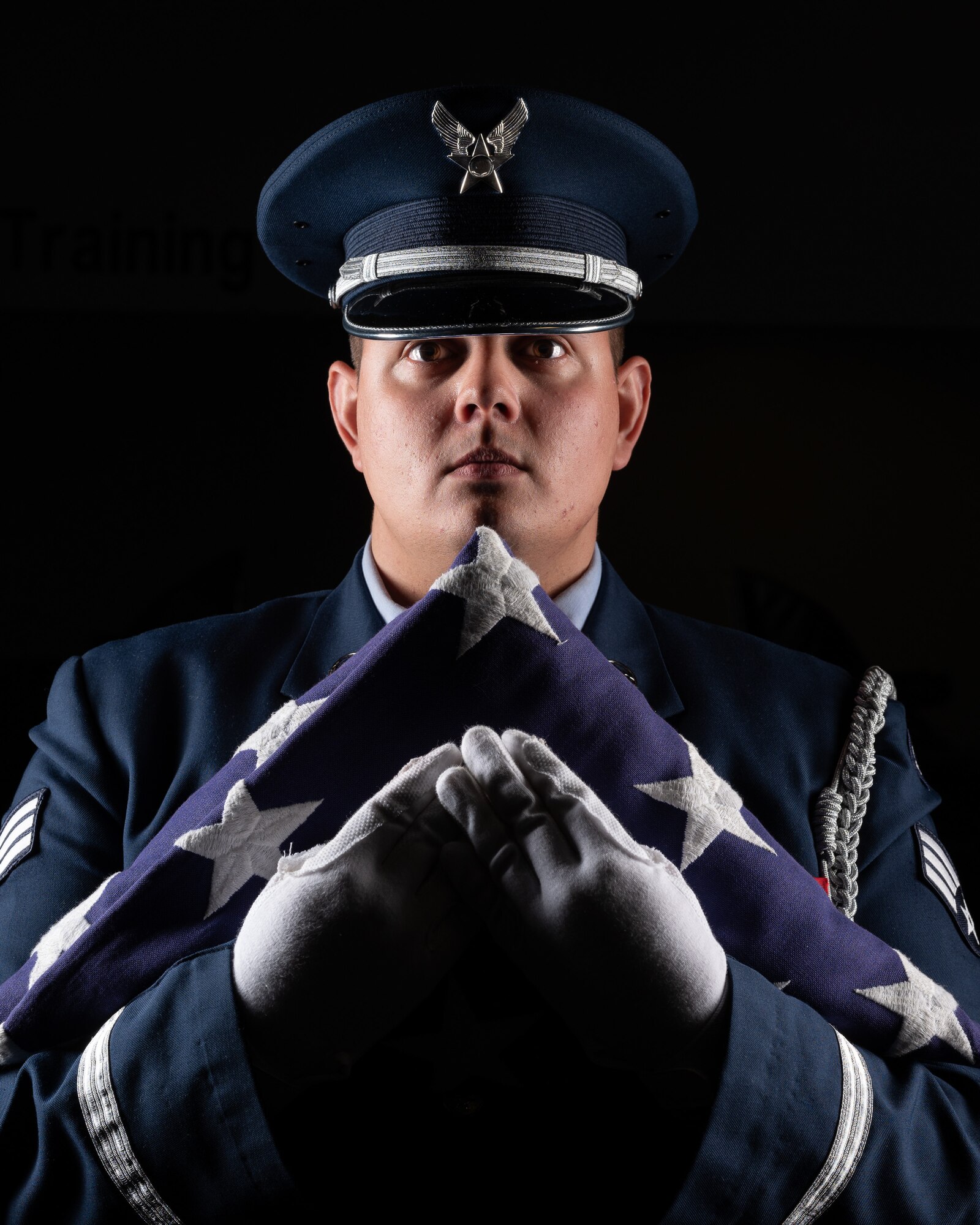 Senior Airman John Riggan, 436th Aerial Port Squadron ramp services specialist, practices flag folding at the Dover Air Force Base Honor Guard facility at Dover Air Force Base, Delaware, July 25, 2023. In addition to supporting ceremonies and events at Dover AFB, the honor guard provides various military honors at funerals for veterans in Delaware, southern New Jersey, south eastern Pennsylvania, and parts of Maryland. (U.S. Air Force by Mauricio Campino)