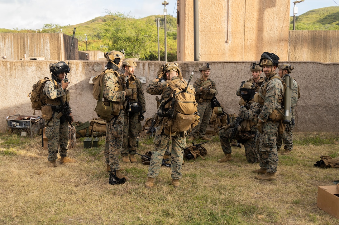 U.S. Marines with Advanced Infantry Training Battalion, School of Infantry-West, Hawaii Detachment, finalize inspections and prepare for urban operations training, Marine Corps Training Area Bellows, July 11, 2023. The training was conducted as part of the Advanced Infantry Marine Course. AIMC is designed to enhance and test Marines’ skills with a focus on reinforcing proper patrols and operational procedures. (U.S. Marine Corps photo by Cpl. Chandler Stacy)