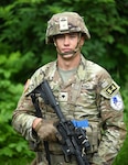 U.S. Army Spc. John Shields, a combat medical specialist with the 334th Brigade Support Battalion, Iowa National Guard, representing Region IV, poses for a photograph during the Army National Guard's Best Warrior Competition, Joint Base Elmendorf-Richardson, Alaska, July 12, 2023.