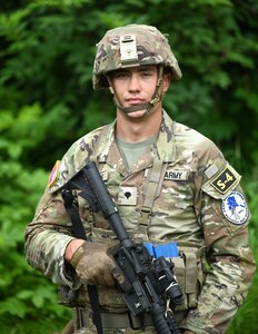 U.S. Army Spc. John Shields, a combat medical specialist with the 334th Brigade Support Battalion, Iowa National Guard, representing Region IV, poses for a photograph during the Army National Guard's Best Warrior Competition, Joint Base Elmendorf-Richardson, Alaska, July 12, 2023.