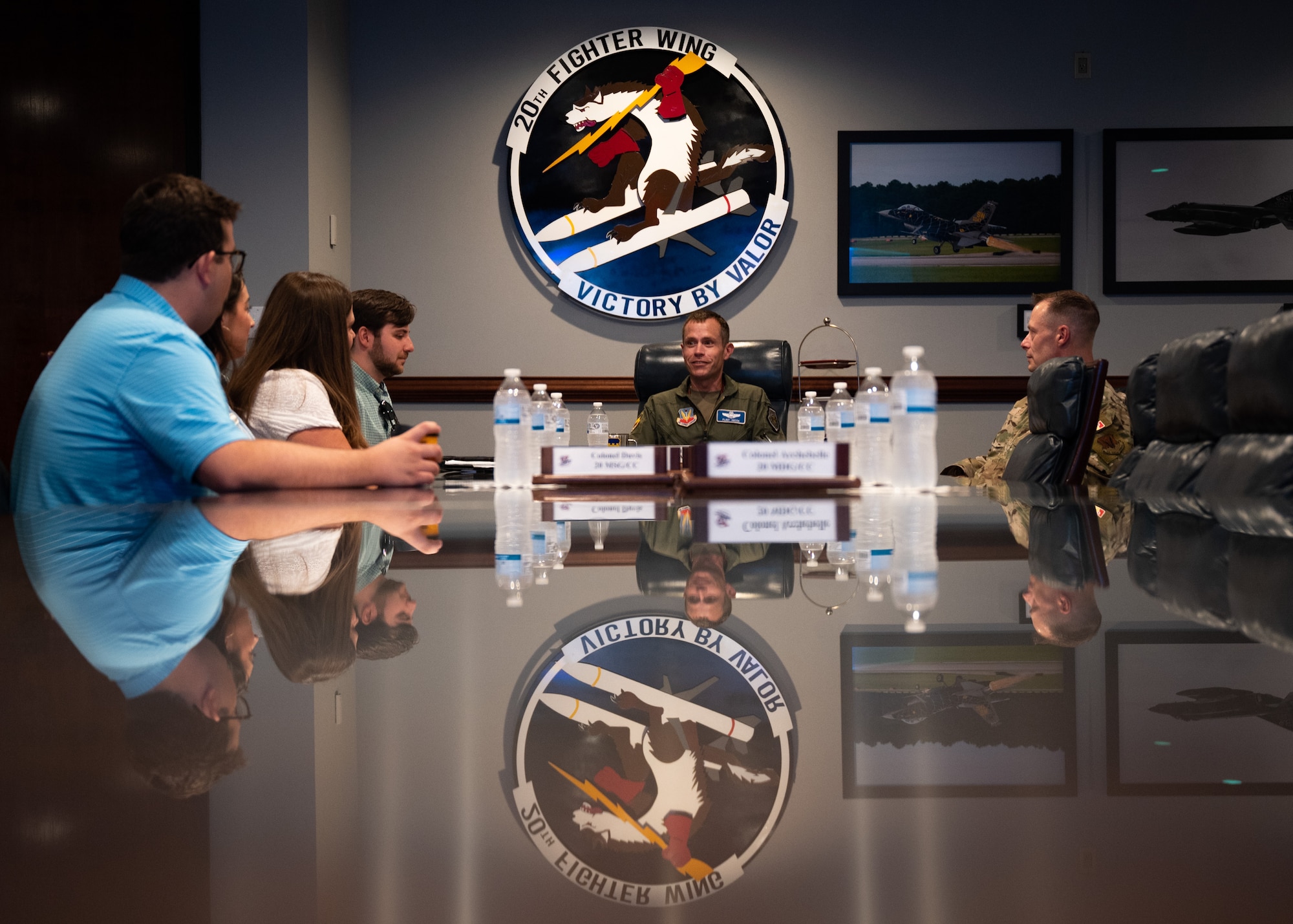 Multiple individuals sit at a conference room table at Shaw Air Force Base, S.C.
