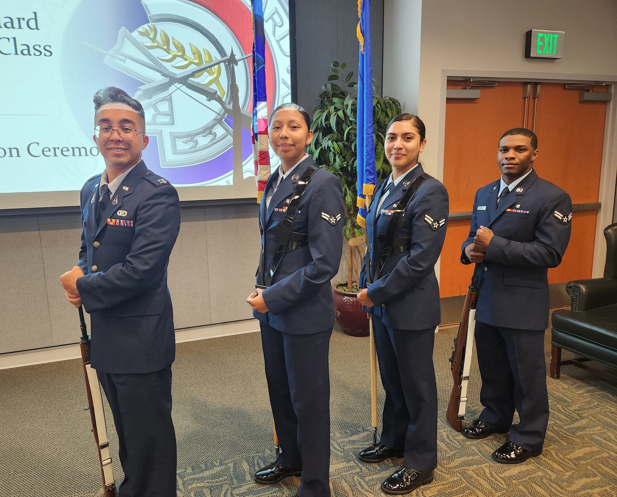 Capt. Roberto Amaya, Airman 1st Class Litzy Jaime, Airman 1st Class Alicia Ramirez, and Airman 1st Class Ethan French, new members of the Base Honor Guard stand ready to show their skills on graduation day at Los Angeles Air Force Base July 21 in El Segundo, Calif.