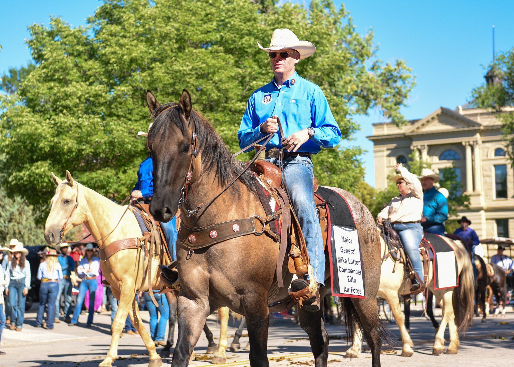 general riding a light colored horse