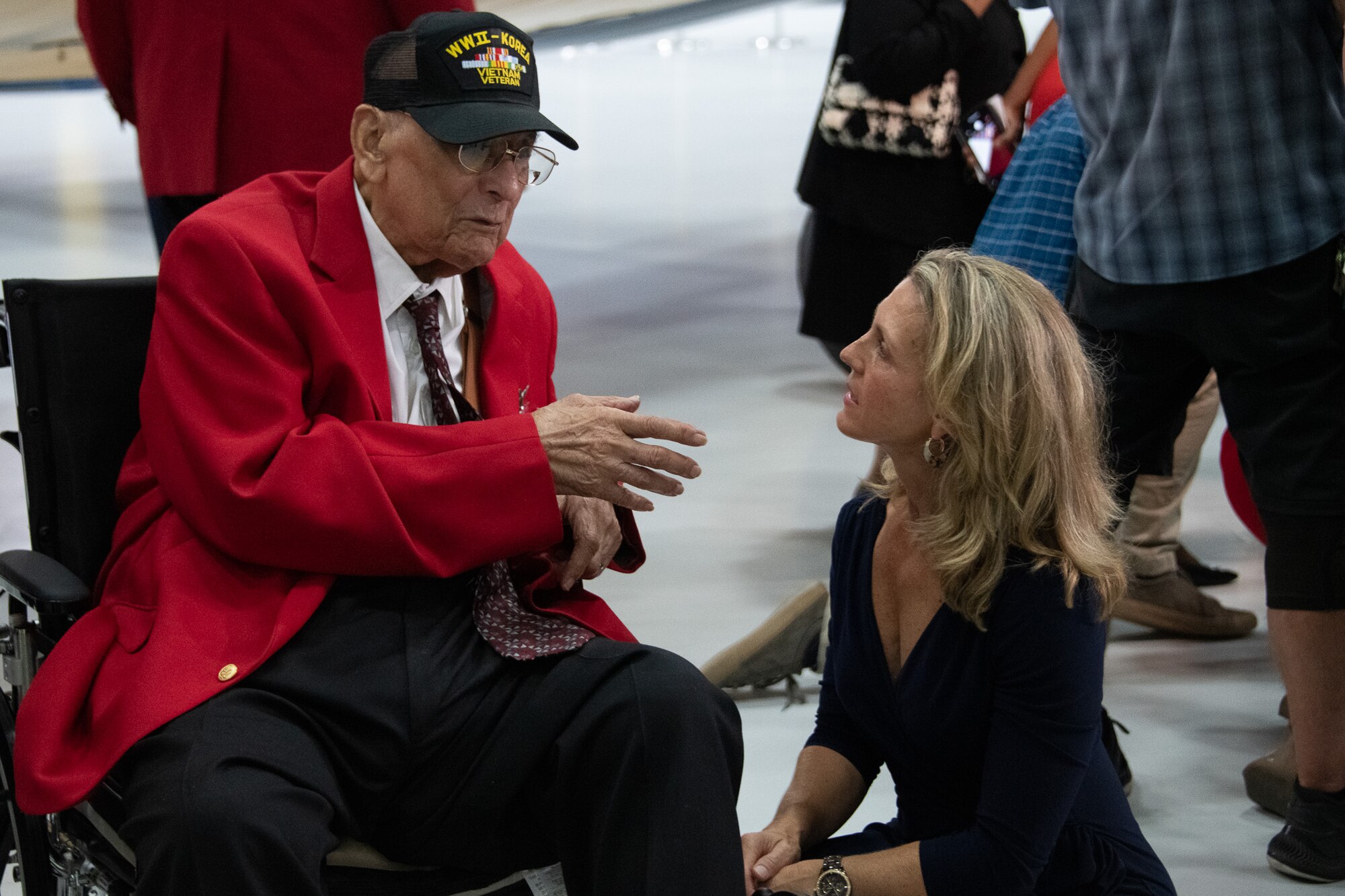 Retired Col. Carl C. Johnson, a Tuskegee Airman, speaks with Heather Penney, a former U.S. Air Force F-16 fighter pilot, during the Tuskegee Airmen PT-17 Stearman Aircraft Exchange ceremony at Joint Base Andrews, Md., July 26, 2023. Penney is known for flying a ramming mission to prevent United Airlines Flight 93 from reaching Washington, D.C. during the 9/11 terrorist attacks in 2001. (U.S. Air Force photo by Senior Airman Tyrone Thomas)