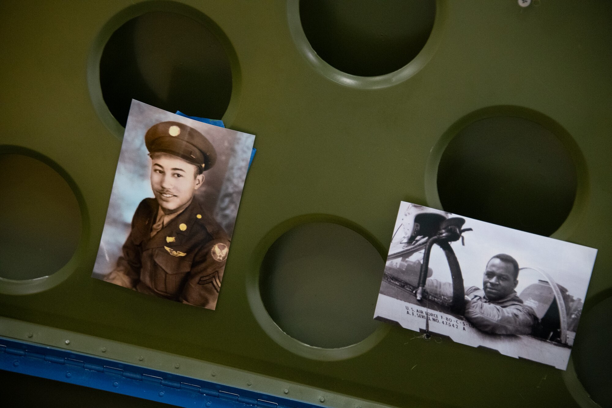 Tuskegee Airmen photos hang inside the PT-17 Stearman during the Tuskegee Airmen PT-17 Stearman Aircraft Exchange ceremony at Joint Base Andrews, Md., July 26, 2023. This PT-17 Stearman aircraft served as a training bi-plane for the Tuskegee Airmen. (U.S. Air Force photo by Senior Airman Tyrone Thomas)