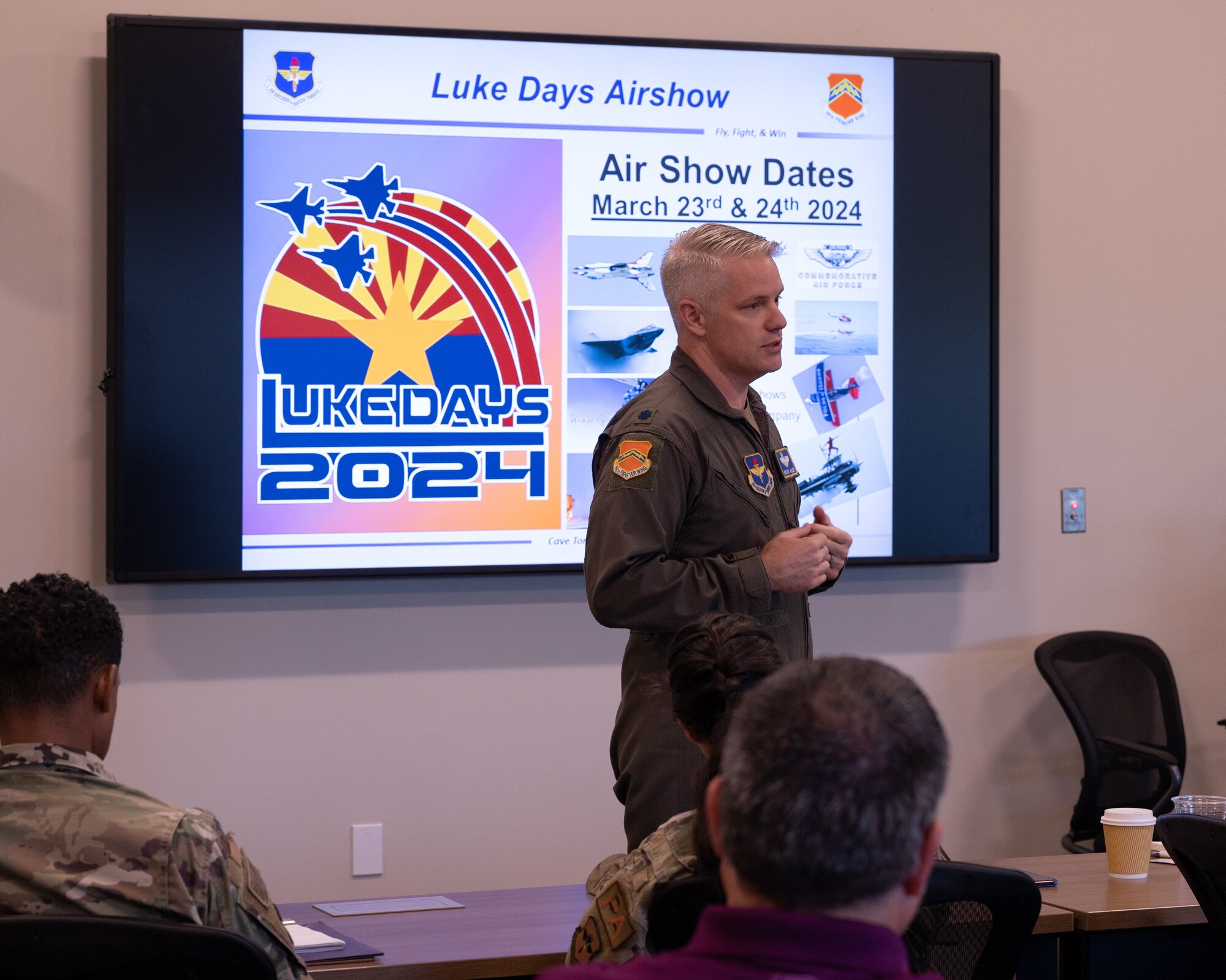 U.S. Air Force Lt. Col. Shawn Walsh, 425th Fighter Squadron and Program Integration Office commander, briefs members of the Air Force Community Partnership Program conduct their first meeting in three years on July 25, 2023, at the Goodyear City Hall in Goodyear, Arizona.