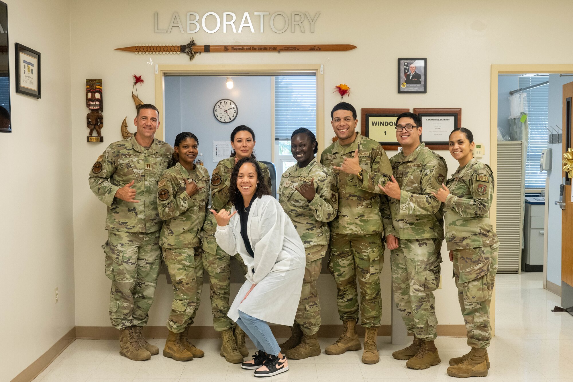 The 15th Medical Group Diagnostics and Therapeutics flight pose for a group photo in front of the laboratory at Joint Base Pearl Harbor-Hickam, July 20, 2023. The laboratory recently earned a perfect score on the civilian accreditation from the College of American Pathologists, it ensures the laboratory is producing accurate and reliable test results and ensures accurate patient diagnosis and care. (U.S. Air Force photo by Senior Airman Makensie Cooper)