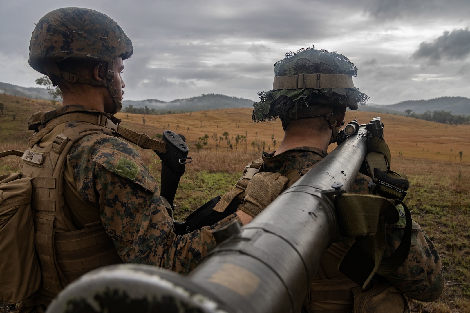 U.S. Marine Corps Lance Cpl. Frank Davis III, left, and Cpl. Simon Li, both low altitude air defense gunners with Marine Medium Tiltrotor Squadron 265 (Rein.), 31st Marine Expeditionary Unit, aim with an FIM-92E stinger missile system during a forward arming and refueling point exercise at Shoalwater Bay Training Area, Australia, July 4, 2023. Marines with 2d LAAD provided a defensive posture for the FARP from aerial threats as part of an expeditionary advanced base of operations. The 31st MEU is operating aboard ships of the America Amphibious Ready Group in the 7th Fleet area of operations to enhance interoperability with allies and partners and serve as a ready response force to defend peace and stability in the Indo-Pacific region. (U.S. Marine Corps photo by Cpl. Christopher R. Lape)