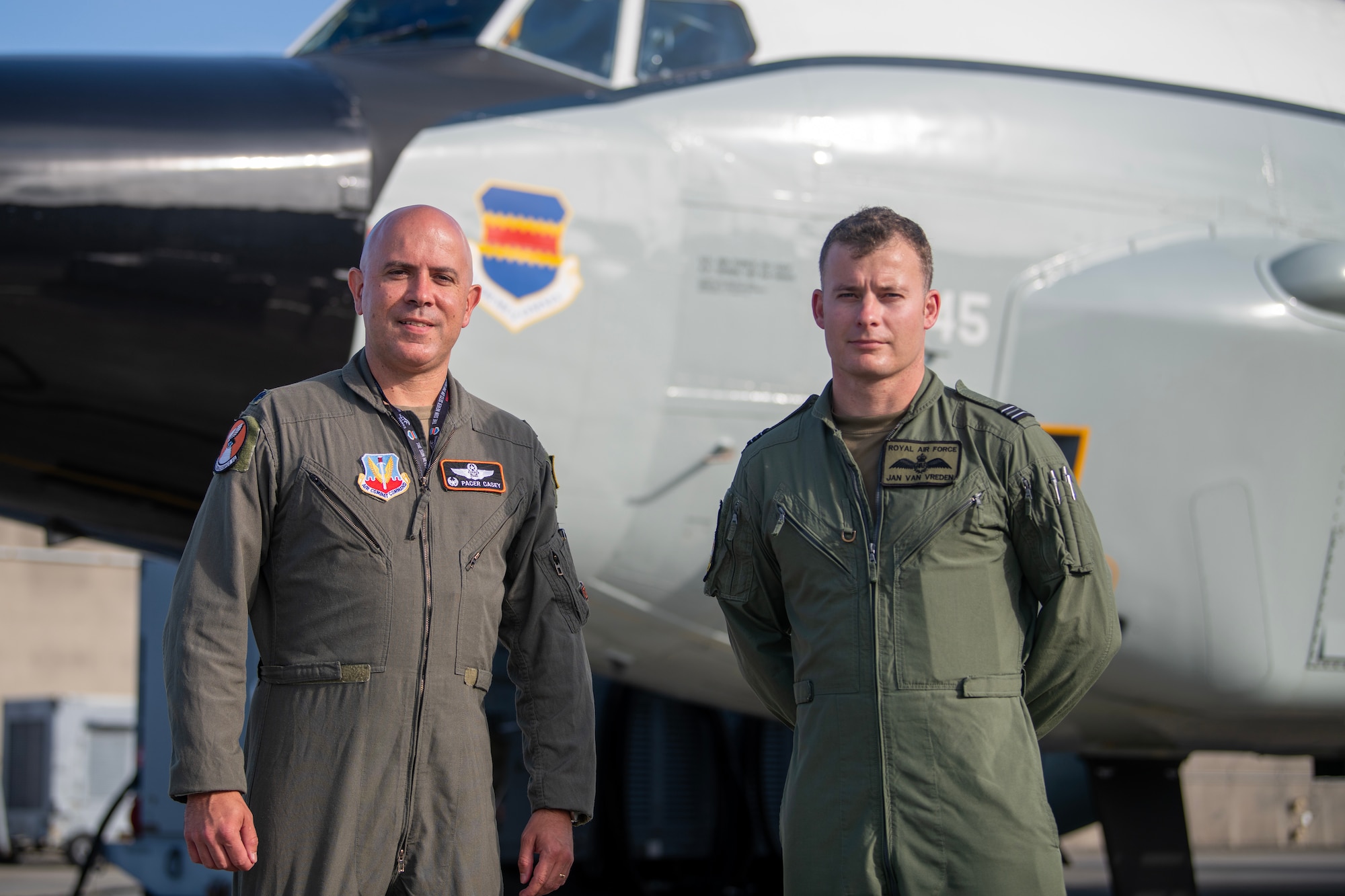 Lt. Col. John Casey poses in front of an RC-135 Rivet Joint with Flt. Lt. Jan Van Vreden