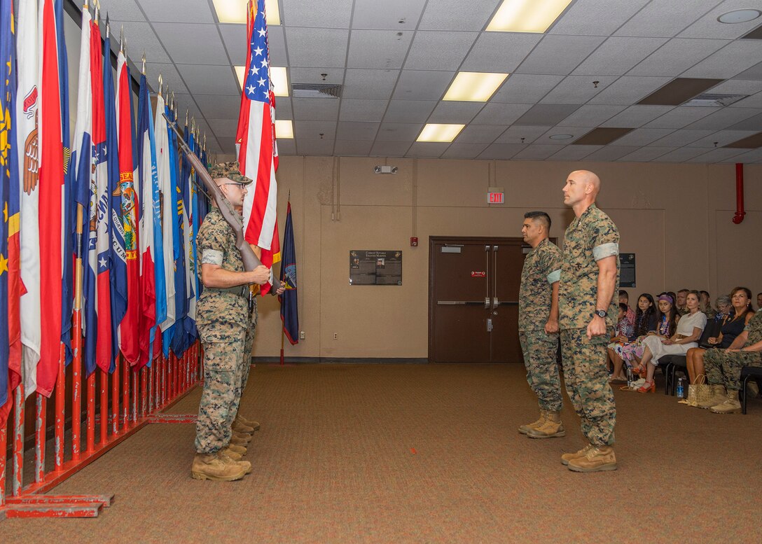 The U.S. Marine Corps Forces, Pacific, Color Guard prepare to present the colors during the Headquarters and Service Battalion Change of Command ceremony at Camp H.M. Smith, Hawaii, July 21, 2023. The change of command ceremony symbolizes the passing of authority between the off-going and on-coming commanding officer. During the ceremony, U.S. Marine Corps Col. Eduardo C. Bitanga II relinquished his duties as commanding officer of HQSVCBN to Col. Mark F. Schaefer. (U.S. Marine Corps photo by Sgt. Danny Nateras)