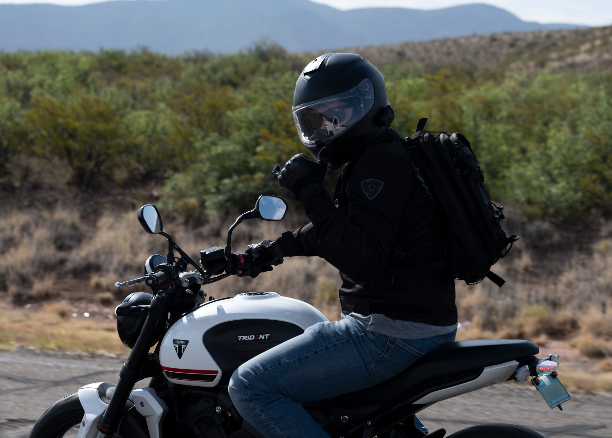 U.S. Air Force Capt. Daniel Neary, 6th Attack Squadron pilot instructor, rides his motorcycle during a summertime mentorship group ride near Holloman Air Force Base, New Mexico, July 21, 2023. The 49th Wing safety group conducts several mentorship rides throughout the year and is designed to help new riders learn from more experienced riders. (U.S. Air Force photo by Airman 1st Class Michelle Ferrari)