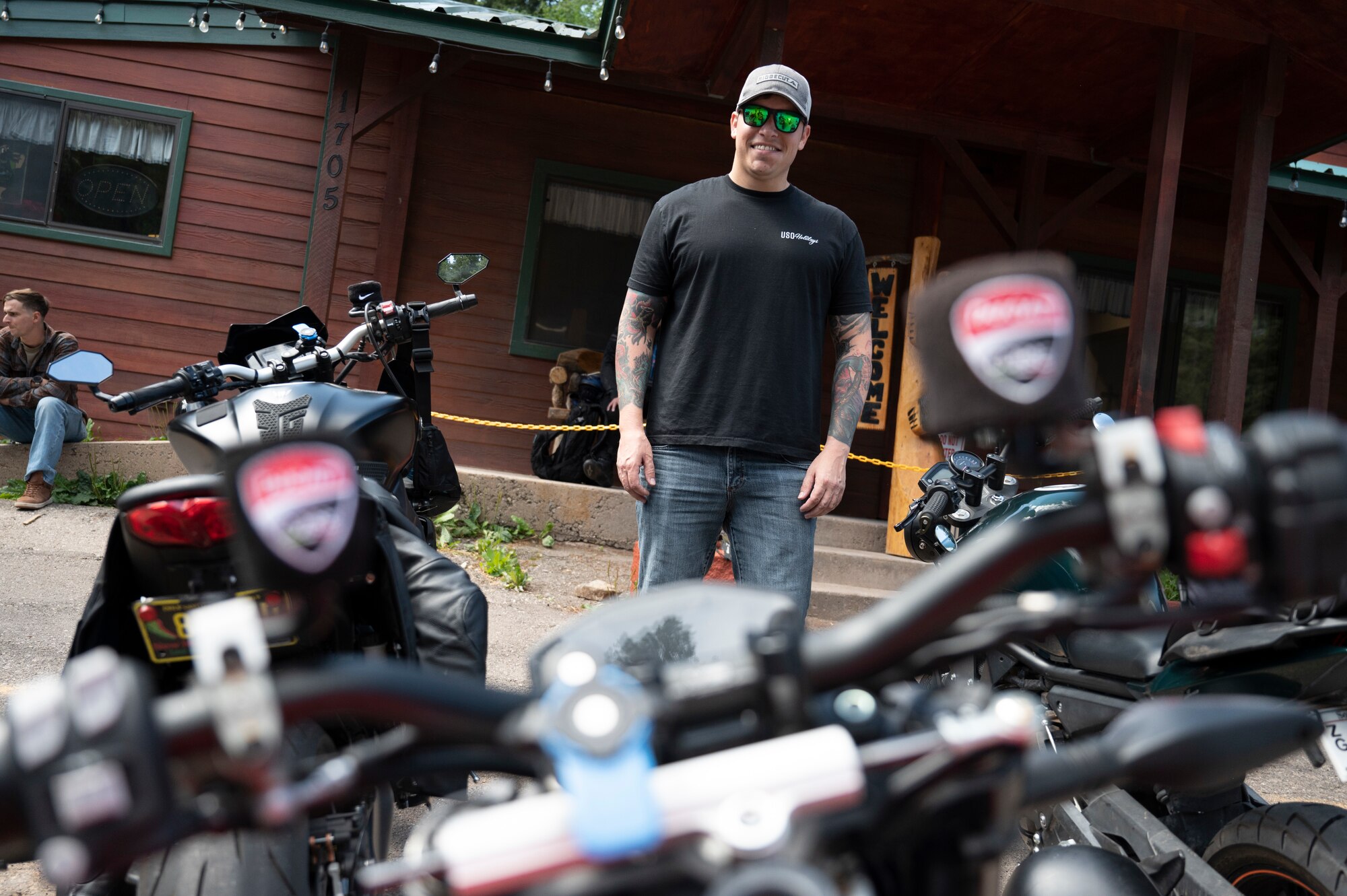 U.S. Air Force MSgt. Justin Bell, 49th Security Forces Squadron flight chief, stands in front of his Ducati Streetfighter motorcycle during group mentorship ride in Ruidoso, New Mexico, July 21, 2023. Mentorship rides allow commanders to coordinate counseling and inspections of riders to ensure their motorcycles are safe to operate and they possess serviceable safety equipment. (U.S. Air Force photo by Airman 1st Class Michelle Ferrari)