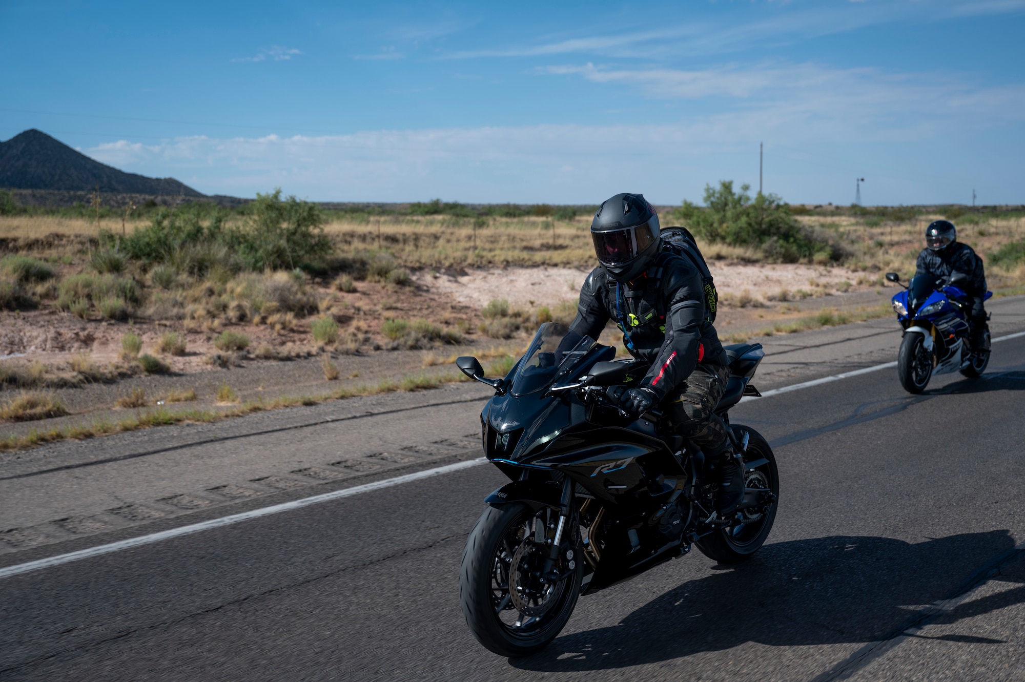 U.S. Air Force MSgt. Josean Arce, 704th Test Group weapons safety manager, (left), participates in group mentorship ride alongside U.S. Air Force Airman 1st Class Vincent Yandell, 849th Aircraft Maintenance Squadron weapons load crew member, near Holloman Air Force Base, New Mexico, July 21, 2023. The 49th Wing safety group conducts several mentorship rides throughout the year designed to help new riders learn from experienced riders. (U.S. Air Force photo by Airman 1st Class Michelle Ferrari)
