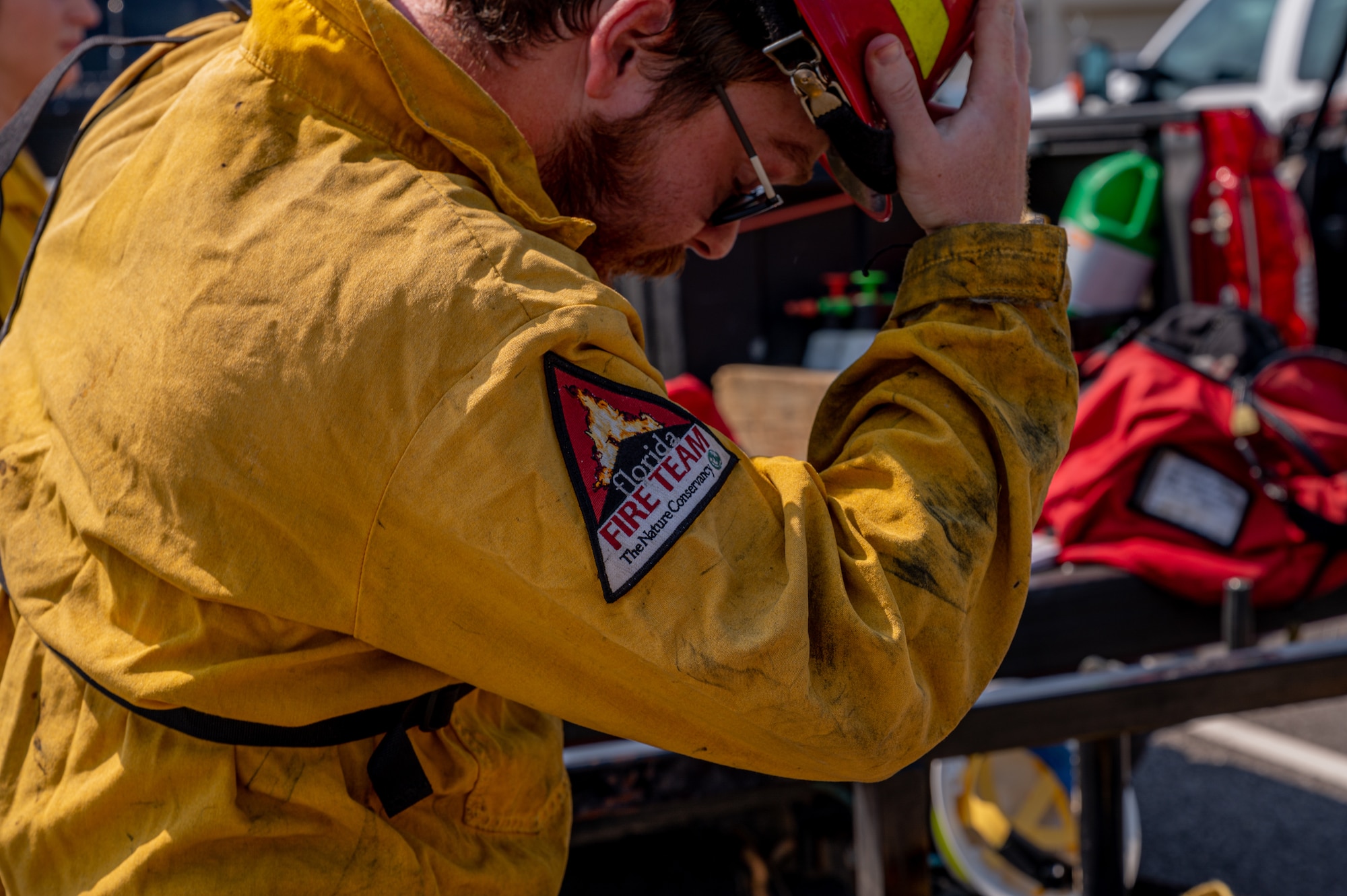 A person dons protective equipment