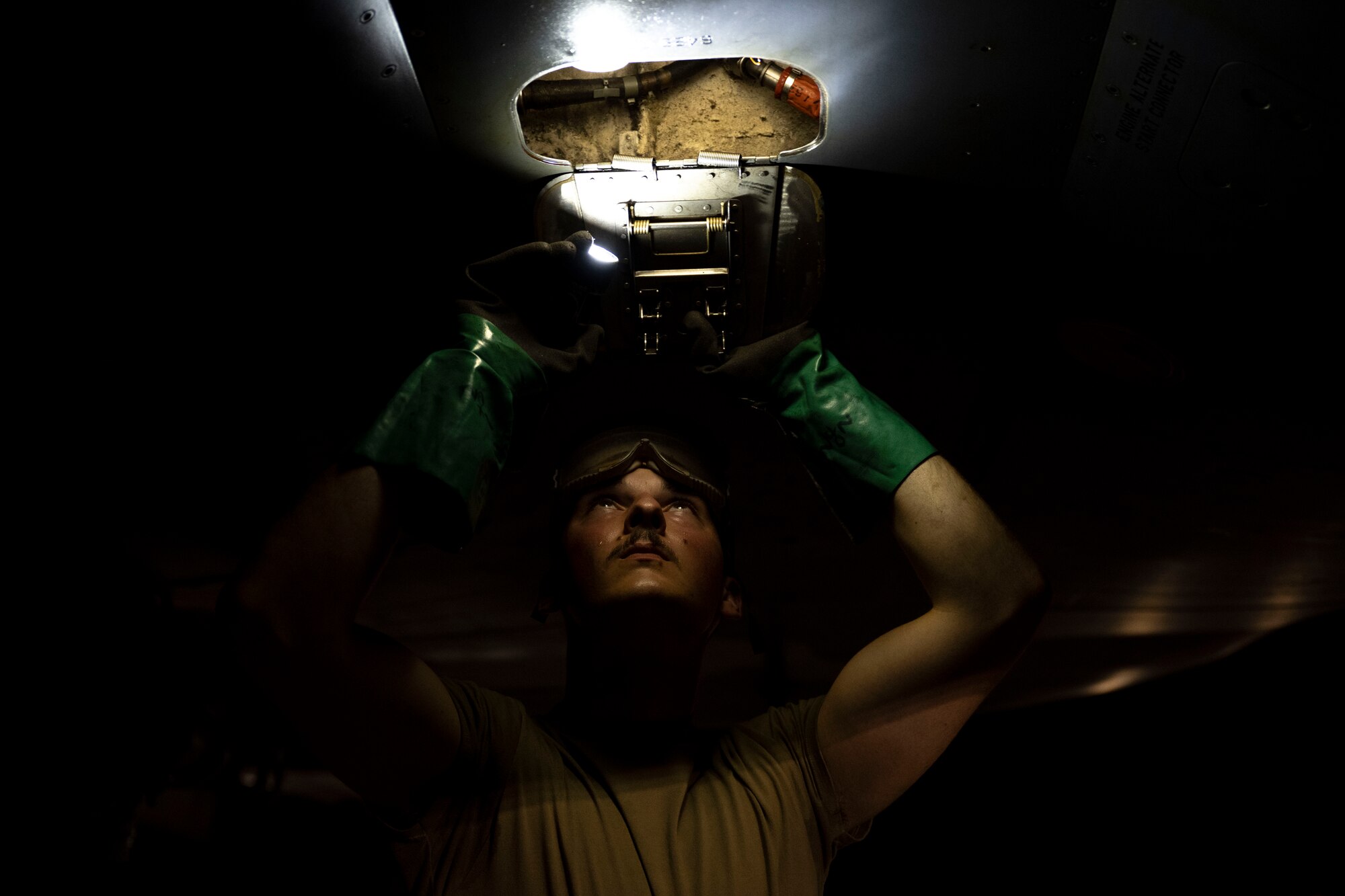 U.S. Air Force Airman 1st Class Luciano Battalini, 28th Aircraft Maintenance Squadron aerospace propulsion specialist, services a B-1B Lancer’s gear box at Nellis Air Force Base, Nev., July 20, 2023.