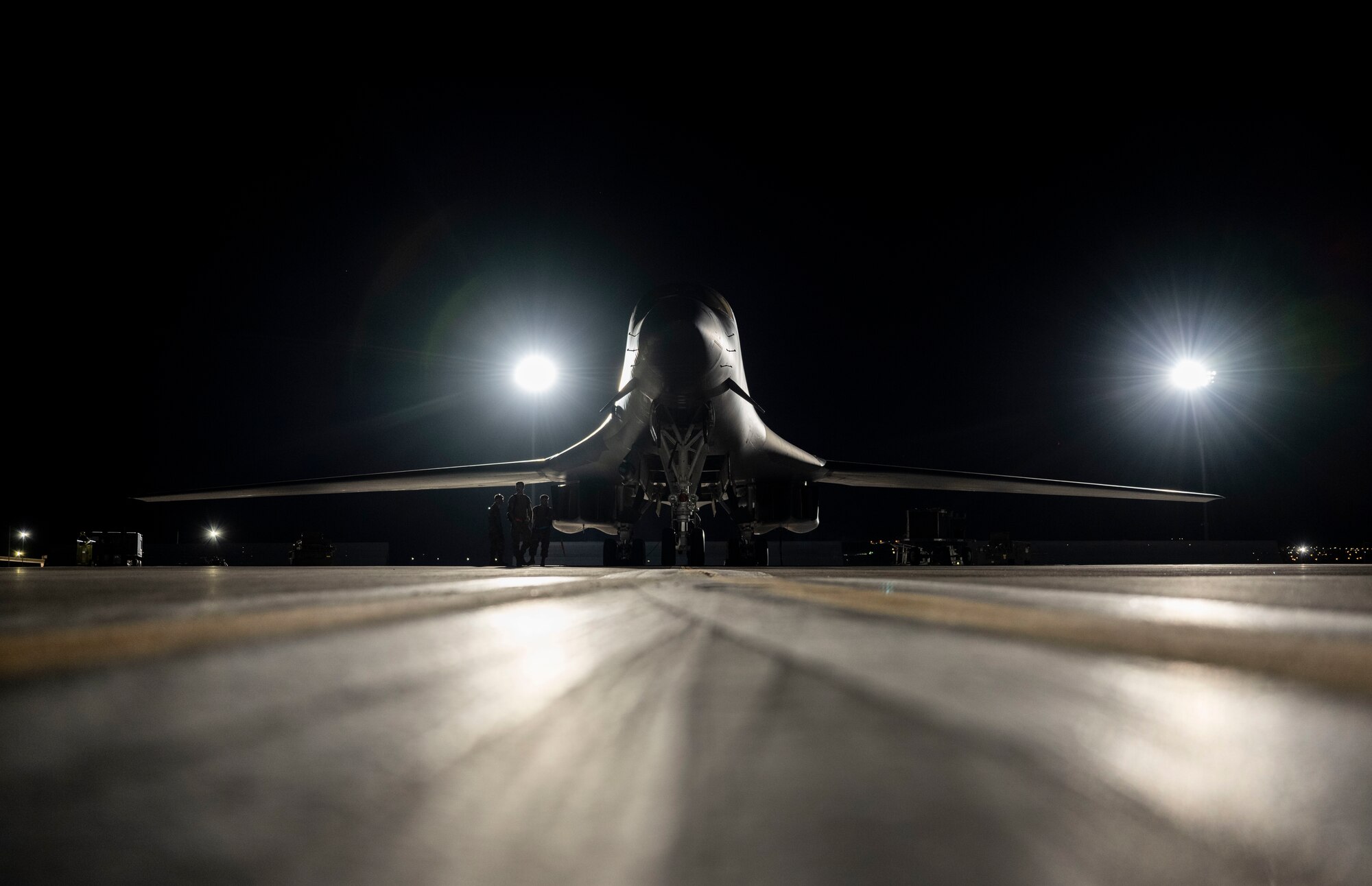 A U.S. Air Force weapons load crew arms a B-1B Lancer assigned to the 34th Bomb Squadron at Nellis Air Force Base, Nev., July 20, 2023.