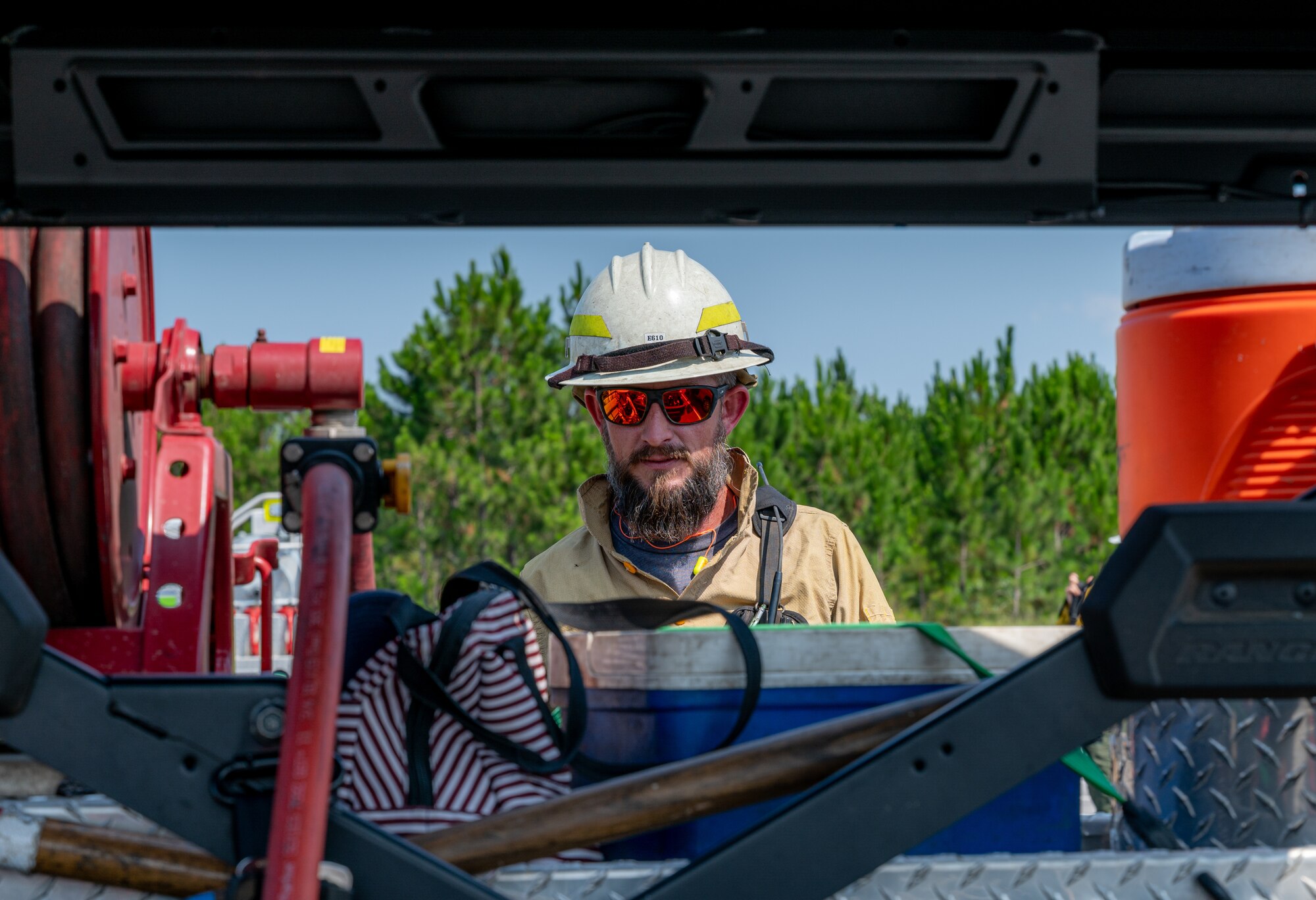 A person examines gear