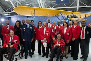 Retired Col. Carl C. Johnson, a Tuskegee Airman, answers interview questions during the Tuskegee Airmen PT-17 Stearman Aircraft Exchange ceremony at Joint Base Andrews, Md., July 26, 2023. The ceremony coincided with the 75th anniversary of the signing by President Harry S. Truman of Executive Order 9981 directing the military to end segregation. (U.S. Air Force photo by Senior Airman Tyrone Thomas)