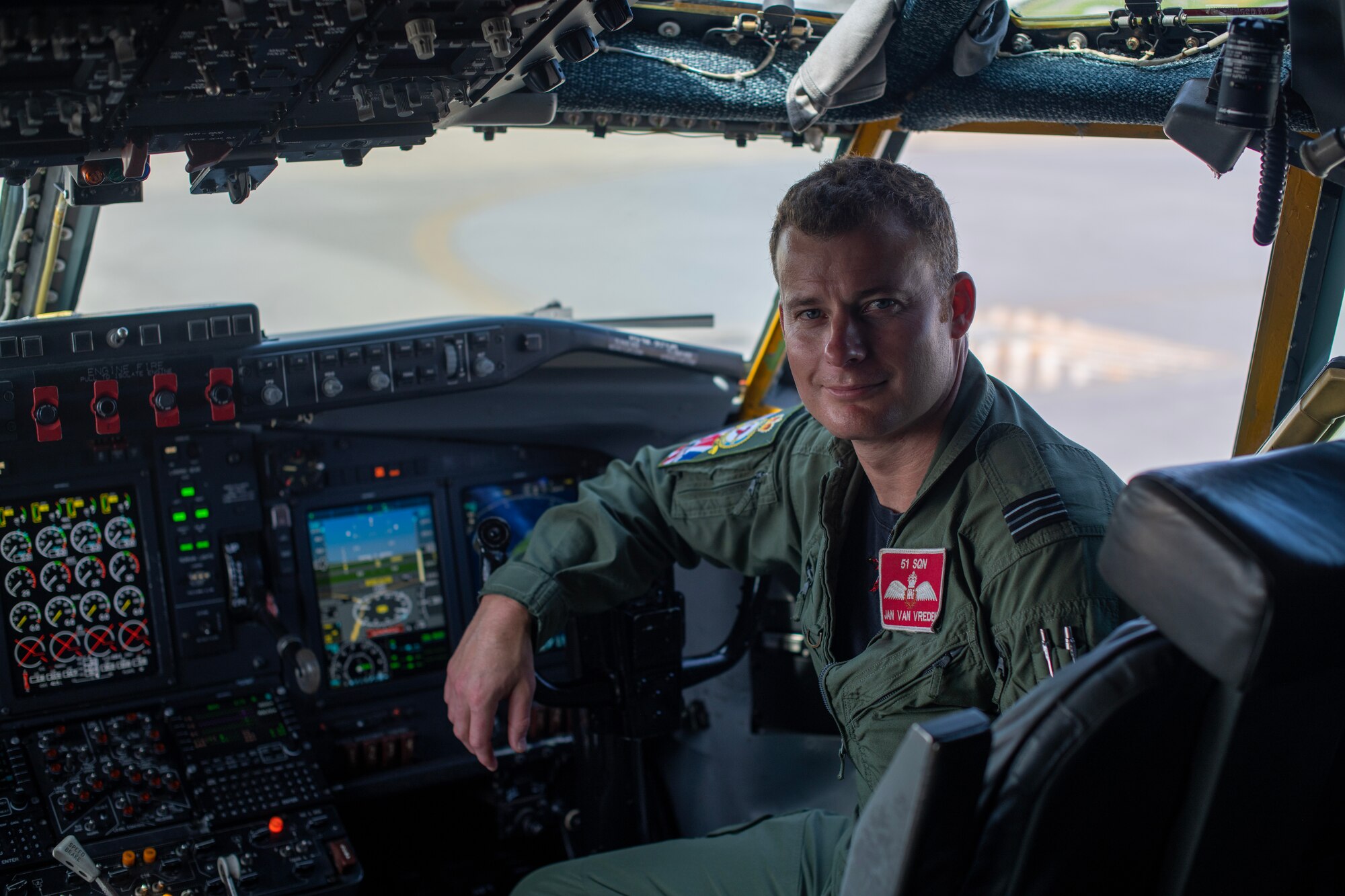 Flight Lieutenant Van Vreden poses inside of a RC-135 Rivet Joint