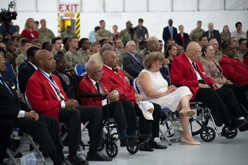 Tuskegee Airmen and attendees listen to a speaker during the Tuskegee Airmen PT-17 Stearman Aircraft Exchange ceremony at Joint Base Andrews, Md., July 26, 2023. The ceremony featured a restored PT-17 Stearman that was used as a trainer for the Tuskegee Airmen. (U.S. Air Force photo by Senior Airman Tyrone Thomas)