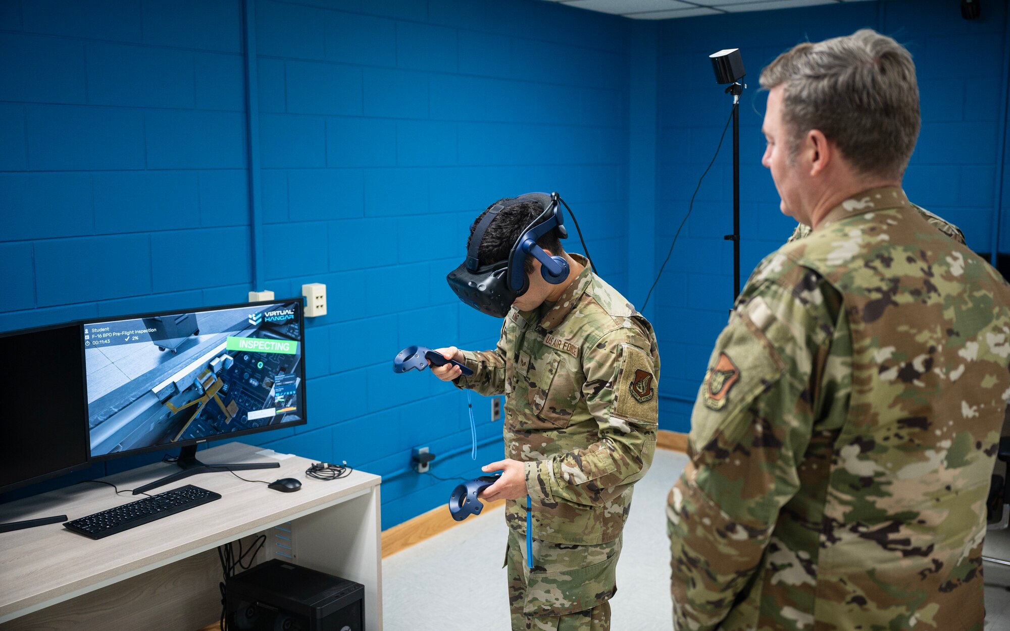 Senior Airman Zachary King demonstrates the practical use of virtual reality training for Chief Master Sgt. Jeremiah W. Ross, 7th Air Force command chief, during his visit at Kunsan Air Base