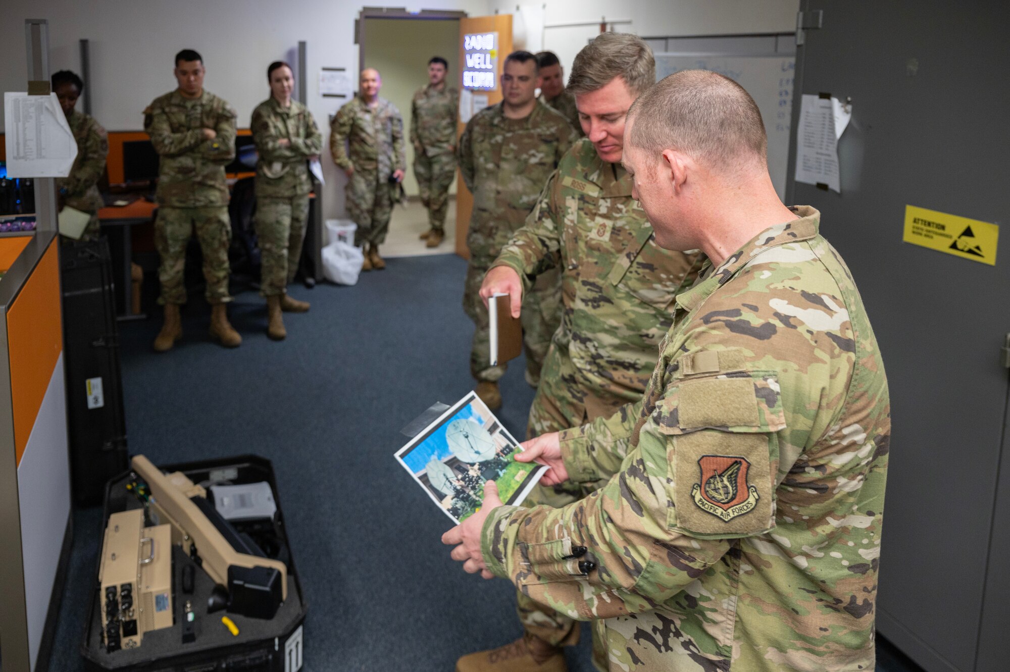 8th Communications Squadron radio frequency transmission systems non-commissioned officer in charge, explains the Fly Away Kit’s communication capabilities for the 7th Air Force command chief, during his first immersion tour at Kunsan Air Base