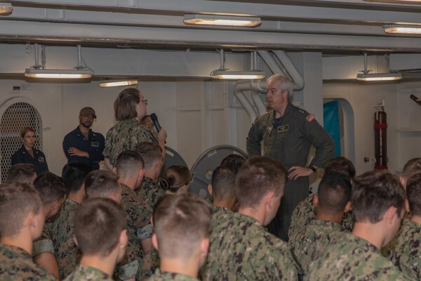 Midshipmen listen to Rear Adm. John Meier