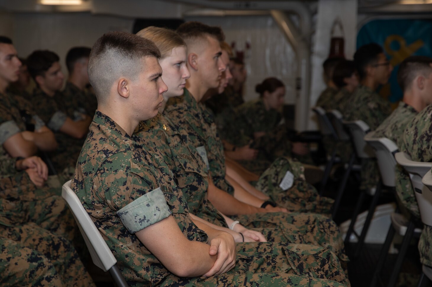 Midshipmen listen to Rear Adm. John Meier