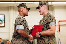 U.S. Marine Corps Lt. Gen. Brian Cavanaugh (left), Commanding General, Fleet Marine Force, Atlantic, Commander, Marine Forces Command, Marine Forces Northern Command, awards Col. Dean Schulz (right), outgoing commander of the Chemical Biological Incident Response Force (CBIRF), the Legion of Merit during the unit's change of command ceremony at Naval Support Facility Indian Head, Maryland, July 7, 2023. Col. Schulz relinquished command of CBIRF to Col. Zeb Beasley II. The ceremony recognizes the significance of the passage of command, honors the organization's accomplishments under the outgoing commander, and formally appoints the incoming commander. (U.S. Marine Corps photo by Staff Sgt. Jacqueline A. Clifford)