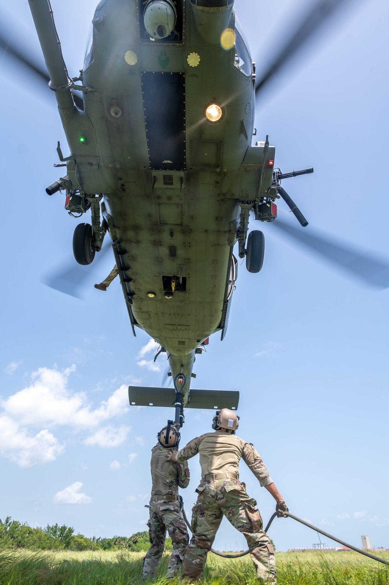 Rescue riggers perform sling load training