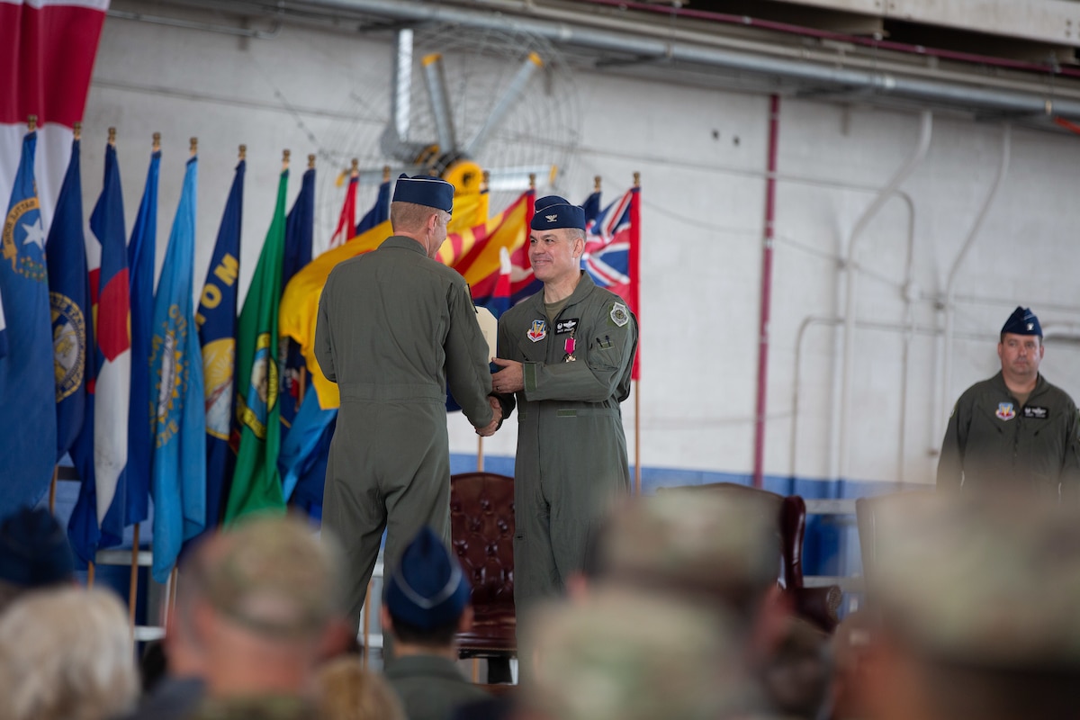U.S. Air Force Warfare Center commander, Maj. Gen. Case Cunningham congratulates Col. Matthew Bradley, the outgoing commander of the 53rd Wing, during a change of command ceremony at Eglin Air Force Base, Florida, July. 21, 2023. The ceremony was a momentous occasion, culminating a distinguished 26-year active-duty career for Bradley. (U.S. Air Force photo by Capt. Lindsey Heflin)