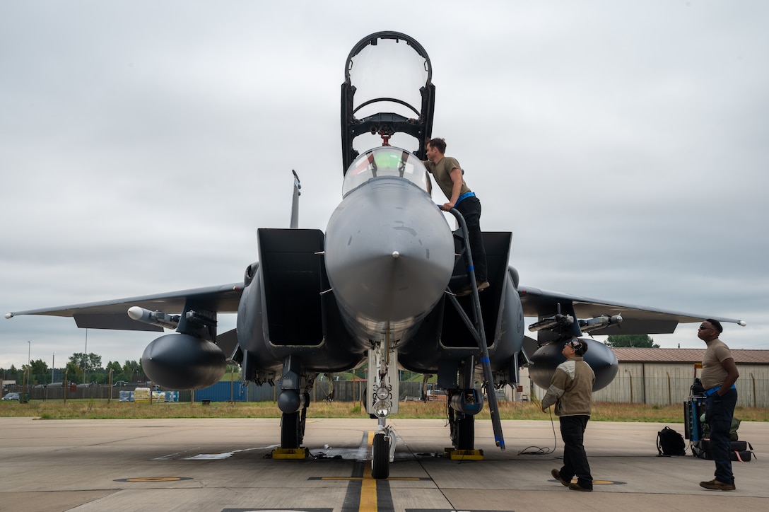 U.S. Air Force crew chiefs assigned to the 492nd Fighter Generation Squadron communicate with aircrew at RAF Lakenheath, July 28, 2023. This particular aircraft has accumulated more than 30,000 maintenance hours over its 31 years of service for the Liberty Wing. (U.S. Air Force photo by Airman Delanie Brown)