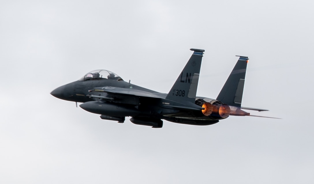 A U.S. Air Force F-15E Strike Eagle takes off at RAF Lakenheath, July 28, 2023. This particular aircraft has been a part of the Liberty Wing for the past 31 years, originally arriving on September 17, 1992, and recently became the first RAF Lakenheath F-15 of any variant to achieve 10,000 flight hours. (U.S. Air Force Airman Delanie Brown)
