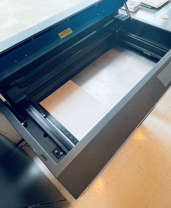 An overhead picture of a laser engraver
