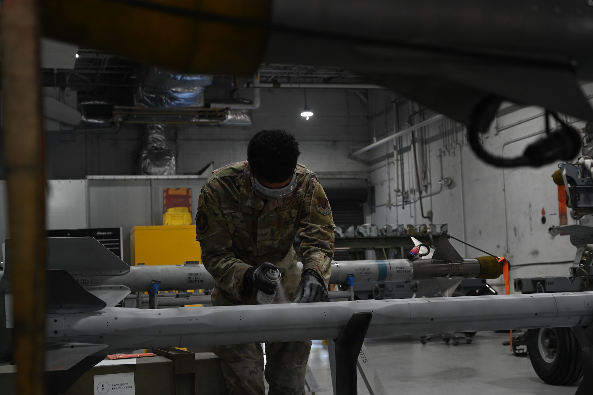 This was part of a weekly maintenance routine that included painting, stencil coating and hangar lubrication for the attachments connecting to the F-15E Strike Eagle. (U.S. Air Force photo by Senior Airman Kylie Barrow)