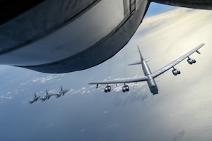 Three Japan Air Self-Defense Force F-2s fly with a U.S. Air Force 2nd Bomb Wing B-52 Stratofortress, and a 92nd Air Refueling Wing KC-135 Stratotanker above the Pacific Ocean, July 13, 2023. The U.S. Air Force’s commitment to defending Japan remains enduring and ironclad. (U.S. Air Force photo by Airman 1st Class Haiden Morris)