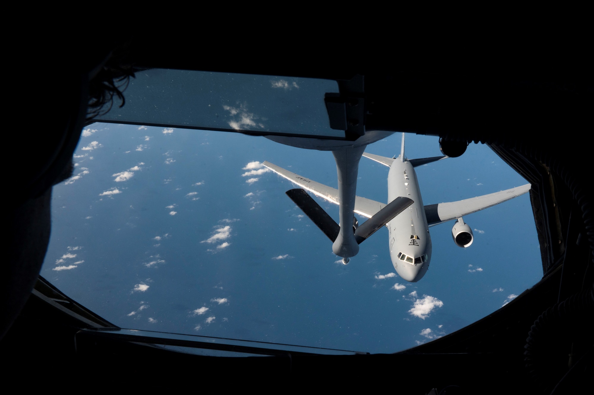 A U.S. Air Force KC-46 Pegasus breaks away from a KC-135 Stratotanker after refueling during Mobility Guardian 23 over the Indo-Pacific region, July 14, 2023. 3,000 personnel directly supported the large-scale mobility exercise, which provided the maneuver of more than 15,000 U.S. and international forces associated with other exercises across the Indo-Pacific held in the same timeframe. (U.S. Air Force photo by Tech. Sgt. Heather Clements)